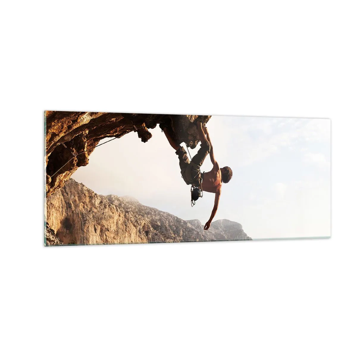 Glasbild - Bild auf glas - Die Welt ist in einer Hand auf einem Felsblock geschrumpft - 100x40 cm