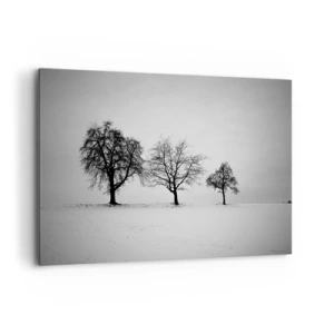 Bild auf Leinwand - Leinwandbild - Drei Bäume auf einem schneebedeckten Feld im monochromen Stil - 100x70cm - Wovon träumen sie? - Moderne Wanddekoration für Wohnzimmer und Schlafzimmer ARTTOR
