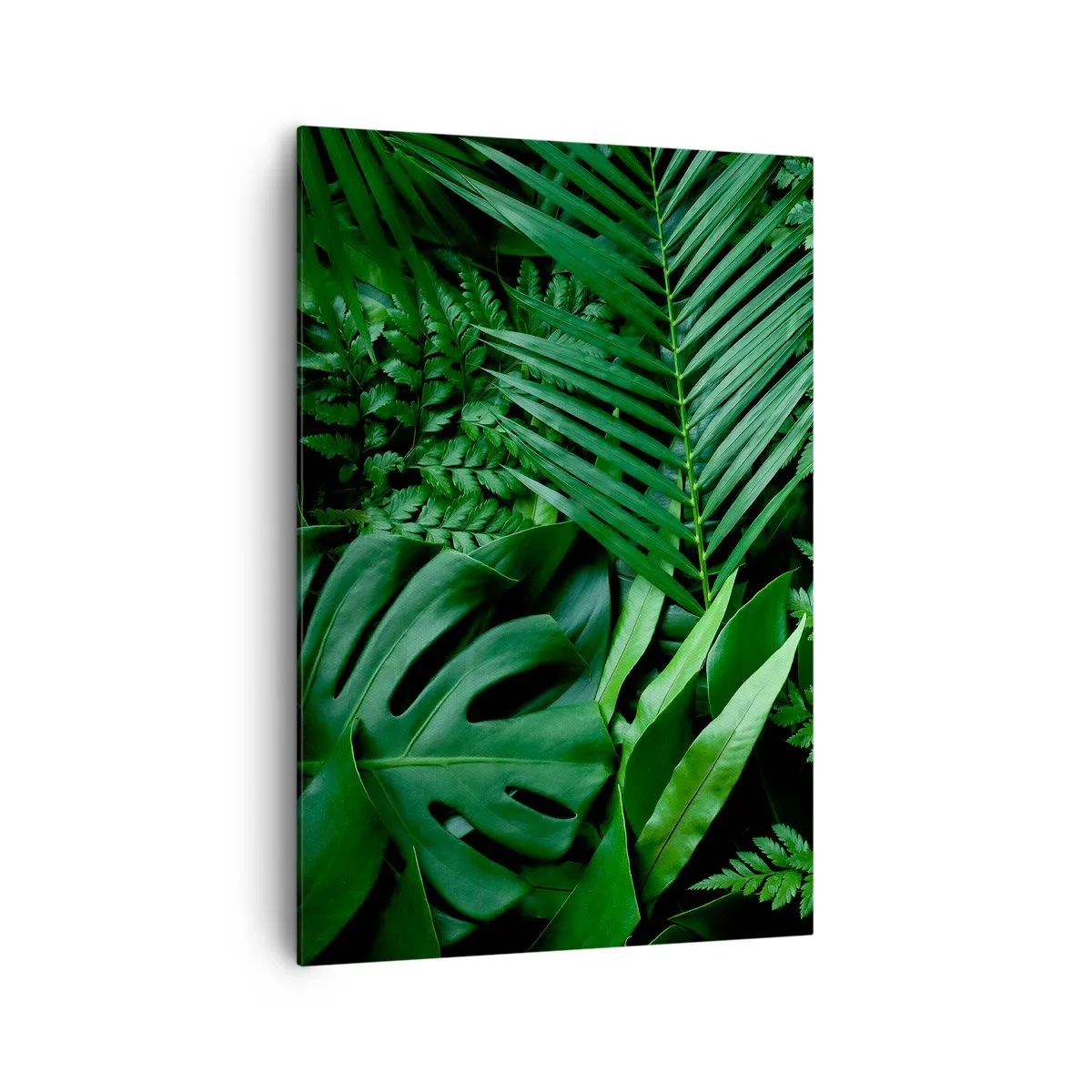 Bild auf Leinwand - Leinwandbild - Grüne tropische Blätter in einer dichten und natürlichen Komposition - 70x100cm - Eingebettet ins Grüne - Moderne Wanddekoration für Wohnzimmer und Schlafzimmer ARTTOR