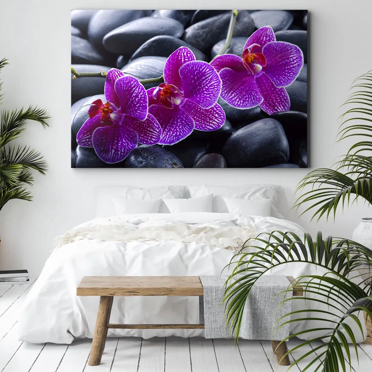 Bild auf Leinwand - Leinwandbild - Lila Orchideen vor einem Hintergrund aus schwarzen Steinen - 100x70cm - Die Steine