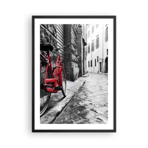 Poster in einem schwarzem Rahmen - Ein rotes Fahrrad auf einer schwarz-weißen Kopfsteinpflasterstraße - 50x70cm - Wahre Schönheit wird nicht alt - Moderne Wanddekoration für Wohnzimmer und Schlafzimmer ARTTOR