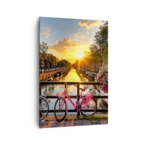 Bild auf Leinwand - Leinwandbild - Fahrräder auf einer Brücke im Schein der untergehenden Sonne - 70x100cm - Frühlingsmorgen in Amsterdam - Moderne Wanddekoration für Wohnzimmer und Schlafzimmer ARTTOR