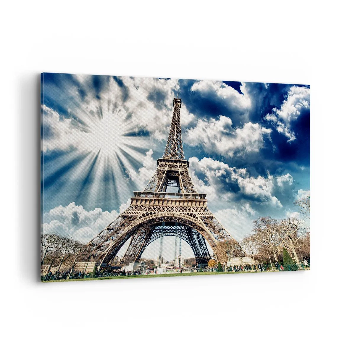Bild auf Leinwand - Leinwandbild - Der Eiffelturm vor einem sonnigen Himmel mit Wolken - 100x70cm - Die Einzige unter der Sonne - Moderne Wanddekoration für Wohnzimmer und Schlafzimmer ARTTOR