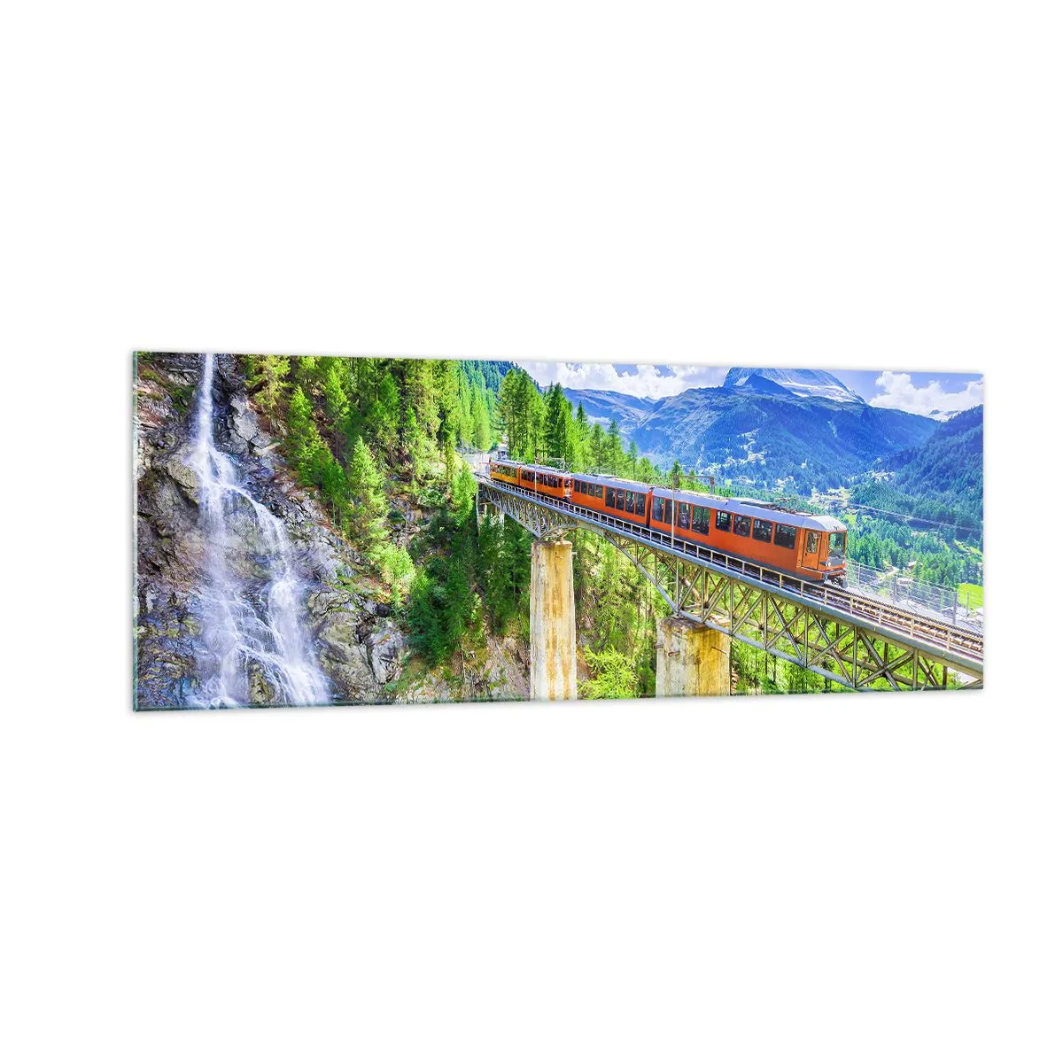Glasbild - Bild auf glas - Eine Achterbahn auf einer Brücke mit Blick auf einen Wasserfall und Berge - 140x50cm - Jetzt sind Alpen dran - Moderne Wanddekoration für Wohnzimmer und Schlafzimmer ARTTOR