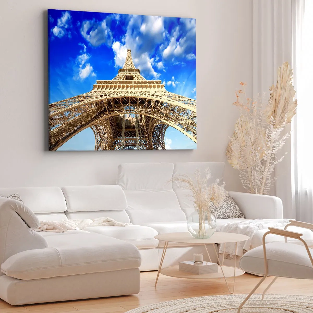 Bild auf Leinwand - Leinwandbild - Der Eiffelturm von unten vor blauem Himmel - 70x50cm - In den Himmel und in die Wolken gehen - Moderne Wanddekoration für Wohnzimmer und Schlafzimmer ARTTOR