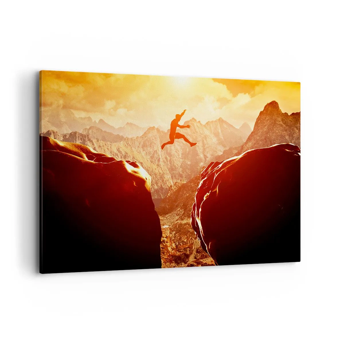 Bild auf Leinwand - Leinwandbild - Eine Figur springt zwischen Felsen mit Bergen im Hintergrund - 120x80cm - Grenzen überschreiten - Moderne Wanddekoration für Wohnzimmer und Schlafzimmer ARTTOR