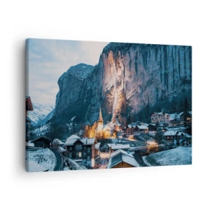 Bild auf Leinwand - Leinwandbild - Ein malerisches Winterdorf, umgeben von Bergen - 70x50cm - Der leuchtende Geist des Winters - Moderne Wanddekoration für Wohnzimmer und Schlafzimmer ARTTOR