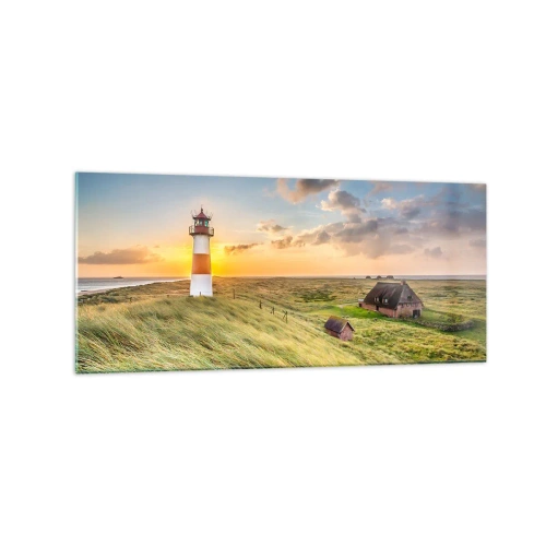 Glasbild - Bild auf glas - Ein Leuchtturm mit Wiesen und Häusern in der Sonne im Hintergrund - 120x50cm - Zwischen den Wellen - Moderne Wanddekoration für Wohnzimmer und Schlafzimmer ARTTOR