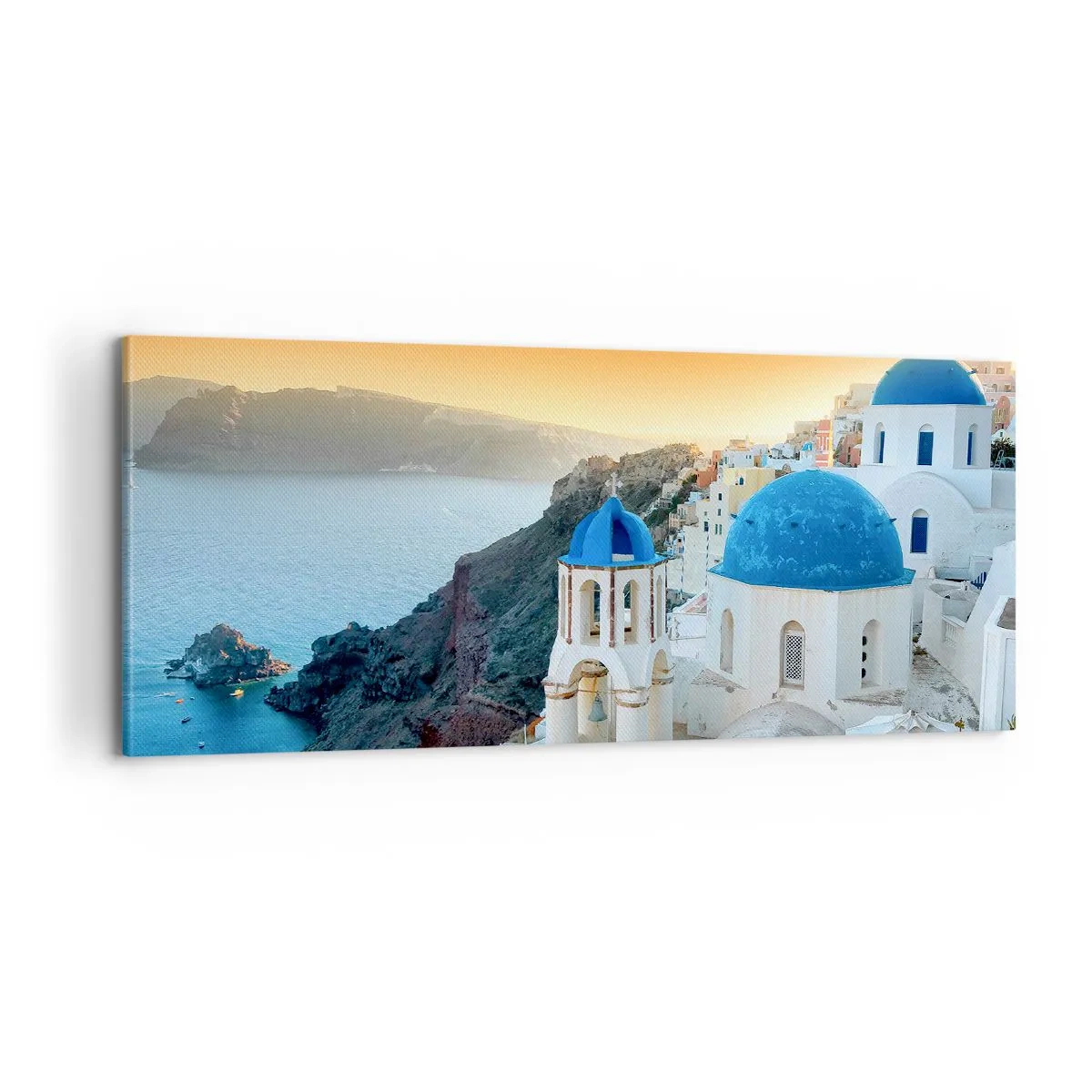 Bild auf Leinwand - Leinwandbild - Santorini - an die Felsen gekuschelt - 100x40 cm