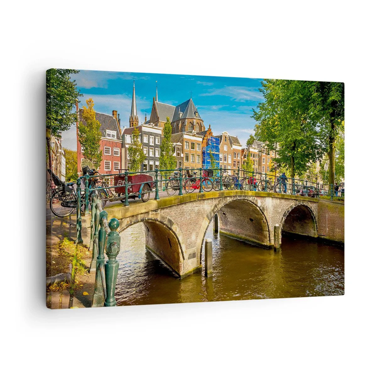 Bild auf Leinwand - Leinwandbild - Ein malerischer Kanal mit einer Brücke in Amsterdam - 70x50cm - Frühling am Kanal - Moderne Wanddekoration für Wohnzimmer und Schlafzimmer ARTTOR