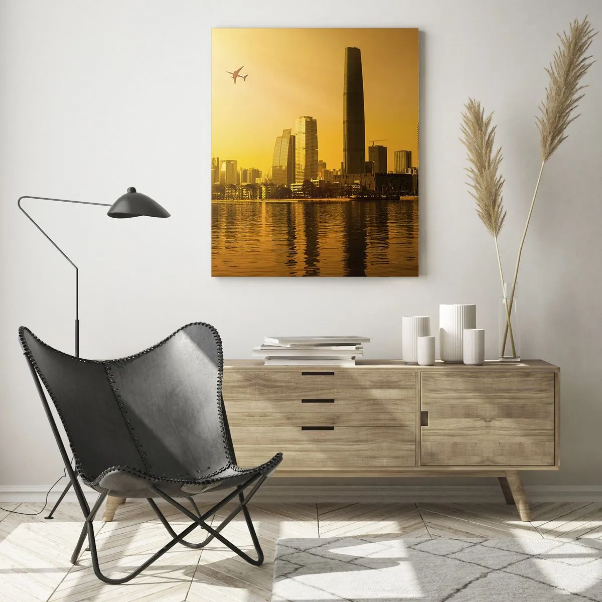 Glasbild - Bild auf glas - Stadtpanorama bei Sonnenuntergang mit Wolkenkratzern und einem Flugzeug - 80x120cm - Die goldene Stadt - Moderne Wanddekoration für Wohnzimmer und Schlafzimmer ARTTOR