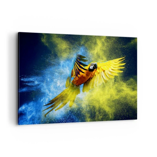 Bild auf Leinwand - Leinwandbild - Ein Papagei im Flug vor einem Hintergrund aus farbenfrohen Explosionen in Gelb und Blau. - 100x70cm - Im blauen und goldenen Staub - Moderne Wanddekoration für Wohnzimmer und Schlafzimmer ARTTOR