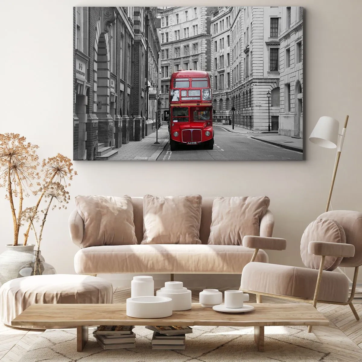 Bild auf Leinwand - Leinwandbild - Ein roter Bus vor einem Hintergrund aus schwarz-weißen Stadtgebäuden. - 70x50cm - Der Alltag muss nicht grau sein - Moderne Wanddekoration für Wohnzimmer und Schlafzimmer ARTTOR