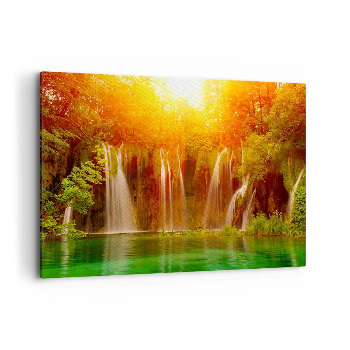Bild auf Leinwand - Leinwandbild - Wasserfälle umgeben von Grün im Schein der untergehenden Sonne - 100x70cm - In der Sonne und im Schatten - Moderne Wanddekoration für Wohnzimmer und Schlafzimmer ARTTOR