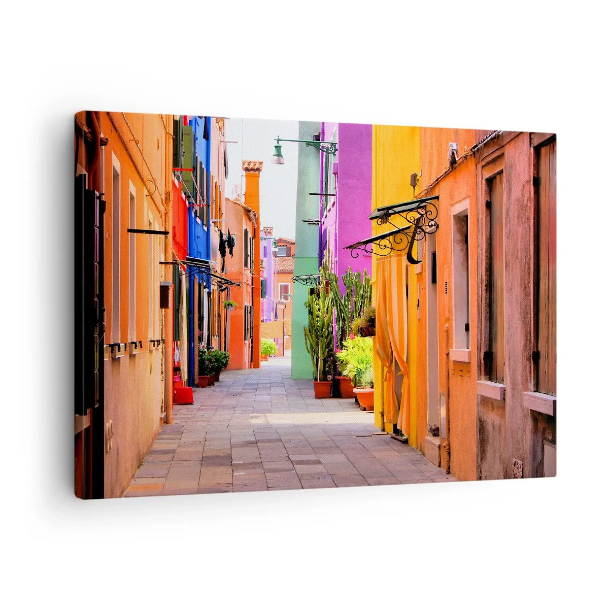 Bild auf Leinwand - Leinwandbild - Eine bunte Straße mit Mietshäusern in hellen Farbtönen - 70x50cm - Regenbogengasse - Moderne Wanddekoration für Wohnzimmer und Schlafzimmer ARTTOR