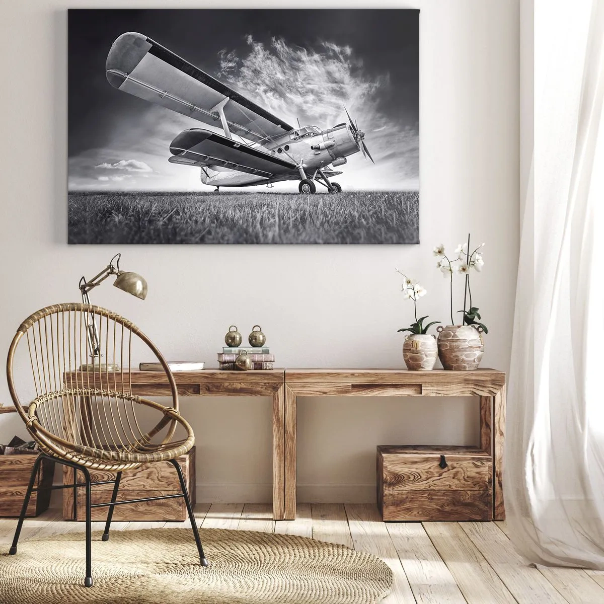 Bild auf Leinwand - Leinwandbild - Ein Flugzeug vor einem dramatischen Himmel in Schwarzweiß - 70x50cm - Der geflügelte Wanderer - Moderne Wanddekoration für Wohnzimmer und Schlafzimmer ARTTOR