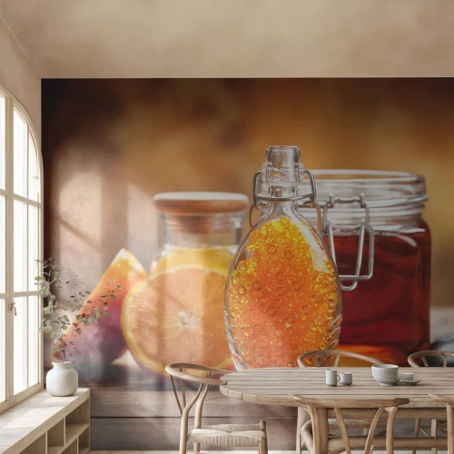 Selbstklebende Fototapete Deluxe Sticker - Sonnige Aromen und Düfte - Gastronomie, Orange, Glas mit Honig - 100x70 cm