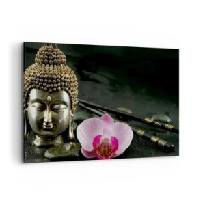 Bild auf Leinwand - Leinwandbild - Eine Buddha-Statuette mit Orchidee und Essstäbchen vor einem Hintergrund aus Steinen - 100x70cm - Harmonie von Weisheit und Schönheit - Moderne Wanddekoration für Wohnzimmer und Schlafzimmer ARTTOR
