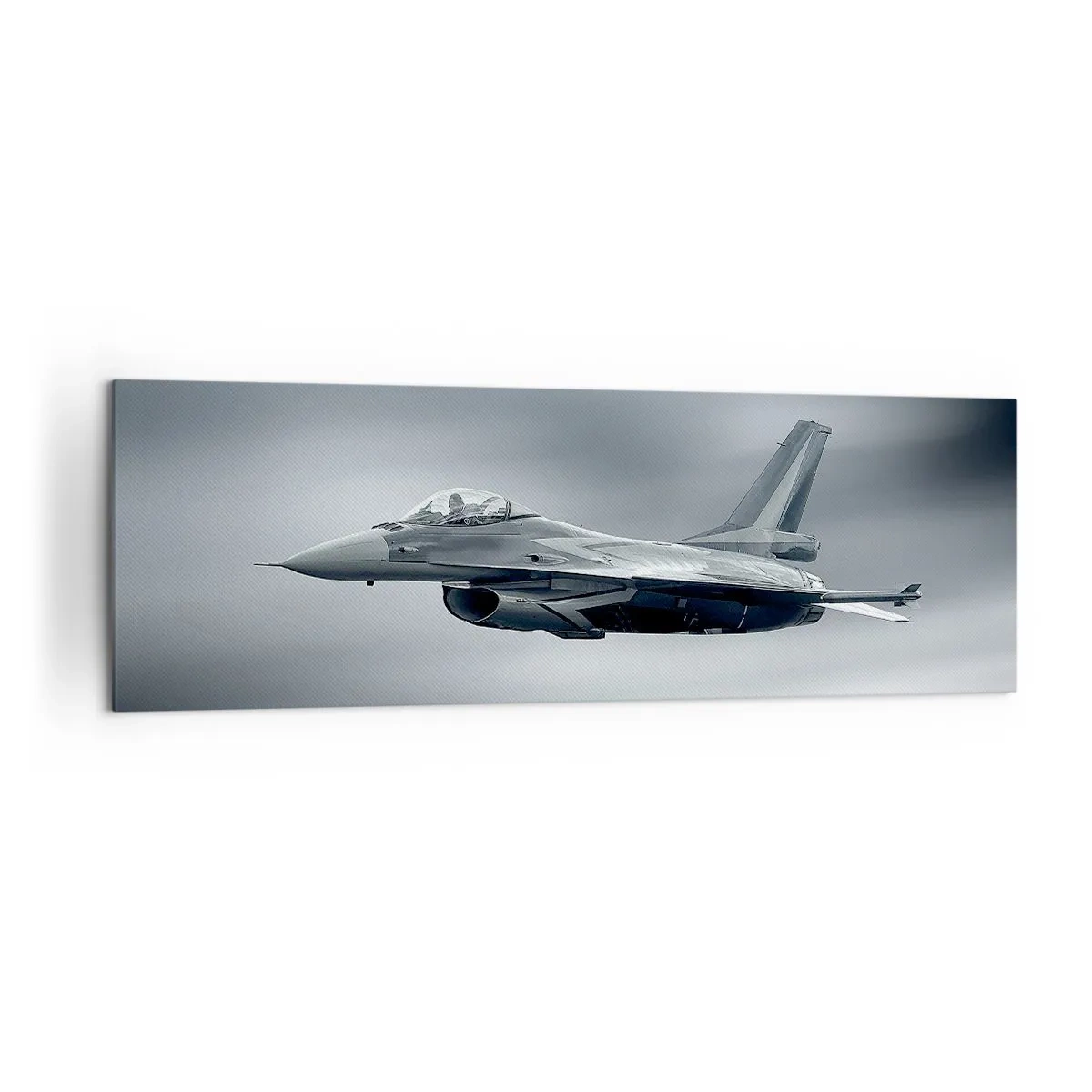 Bild auf Leinwand - Leinwandbild - Ein Kampfjet im Flug vor einem bewölkten Himmel - 160x50cm - Wirst du herausfordern? - Moderne Wanddekoration für Wohnzimmer und Schlafzimmer ARTTOR