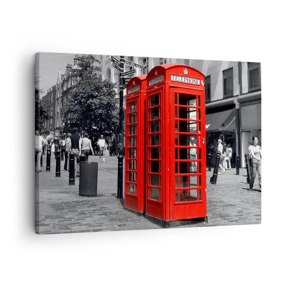 Bild auf Leinwand - Leinwandbild - Rote Telefonzellen vor einer schwarz-weißen Stadtkulisse. - 70x50cm - Rote Telefonzellen - Moderne Wanddekoration für Wohnzimmer und Schlafzimmer ARTTOR