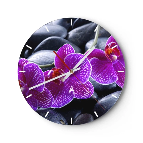 Wanduhr - Glasuhr - Lila Orchideen vor einem Hintergrund aus schwarzen Steinen - 30x30cm - Die Steine