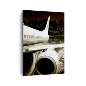 Bild auf Leinwand - Leinwandbild - Ein Flugzeug über einer nächtlichen Stadt mit beleuchteten Autobahnen - 50x70cm - In die Nacht fliegen - Moderne Wanddekoration für Wohnzimmer und Schlafzimmer ARTTOR