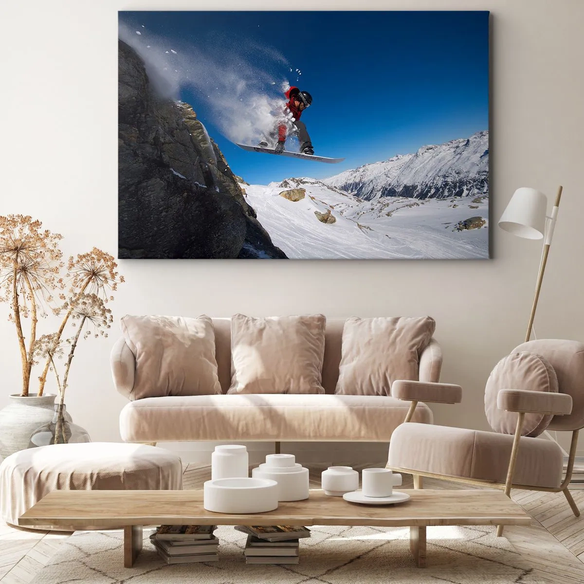 Bild auf Leinwand - Leinwandbild - Ein Snowboarder springt von einem Felsen vor einer Berglandschaft - 70x50cm - Und du wurdest Teil des Raums - Moderne Wanddekoration für Wohnzimmer und Schlafzimmer ARTTOR