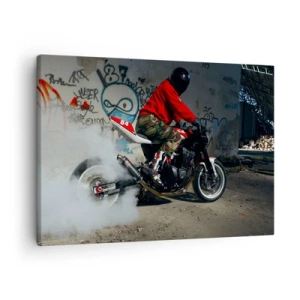 Bild auf Leinwand - Leinwandbild - Ein Motorradfahrer vollführt einen spektakulären Drift in einem verlassenen, mit Graffiti bedeckten Gebäude. - 70x50cm - Verfolge mich! - Moderne Wanddekoration für Wohnzimmer und Schlafzimmer ARTTOR