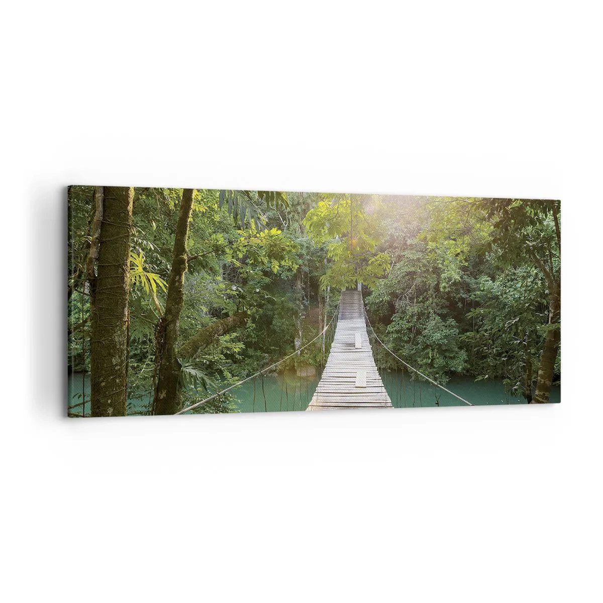 Bild auf Leinwand - Leinwandbild - Eine Hängebrücke in einem tropischen Wald, beleuchtet vom Sonnenlicht. - 120x50cm - Über das azurblaue Wasser zum azurblauen Wald - Moderne Wanddekoration für Wohnzimmer und Schlafzimmer ARTTOR