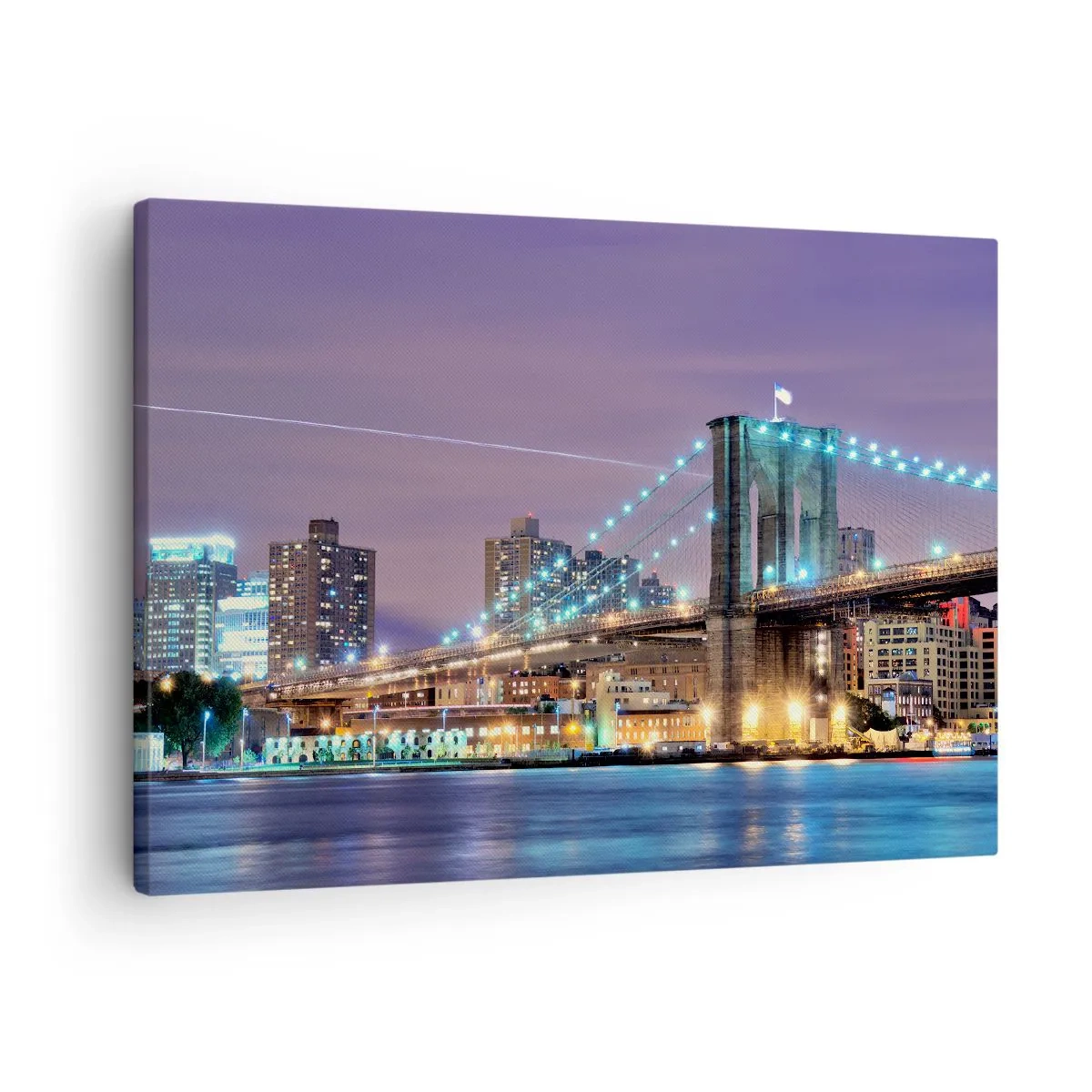 Bild auf Leinwand - Leinwandbild - Brooklyn Bridge bei Nacht mit der beleuchteten Stadt im Hintergrund - 70x50cm - Seit vielen Jahren die Brooklyn Bridge - Moderne Wanddekoration für Wohnzimmer und Schlafzimmer ARTTOR