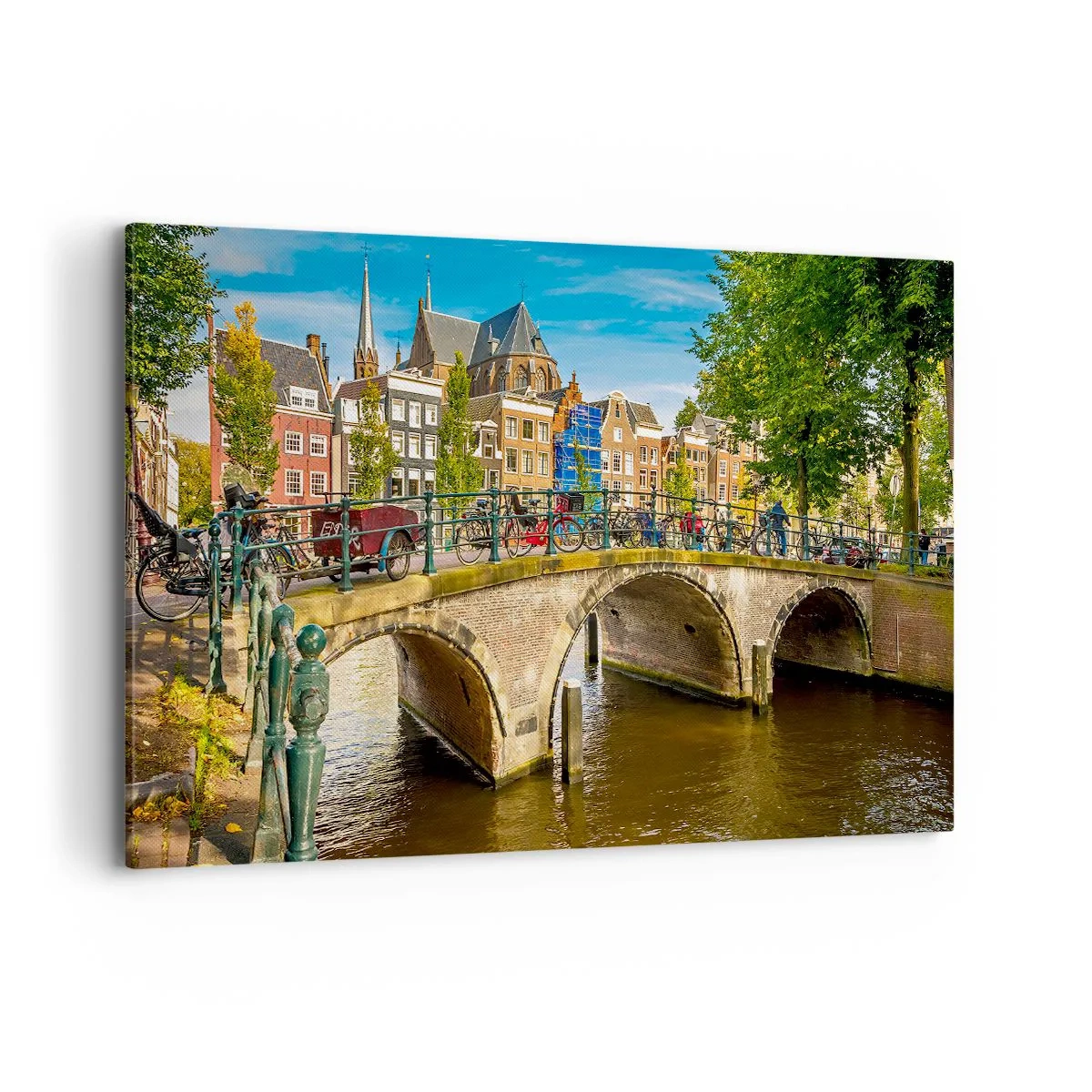 Bild auf Leinwand - Leinwandbild - Ein malerischer Kanal mit einer Brücke in Amsterdam - 120x80cm - Frühling am Kanal - Moderne Wanddekoration für Wohnzimmer und Schlafzimmer ARTTOR