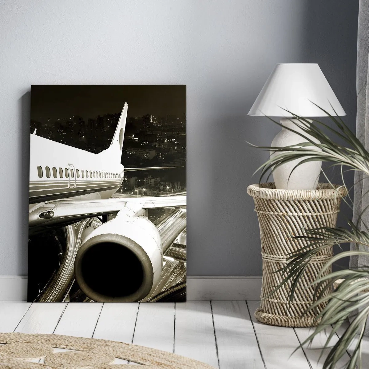 Bild auf Leinwand - Leinwandbild - Ein Flugzeug über einer nächtlichen Stadt mit beleuchteten Autobahnen - 70x100cm - In die Nacht fliegen - Moderne Wanddekoration für Wohnzimmer und Schlafzimmer ARTTOR